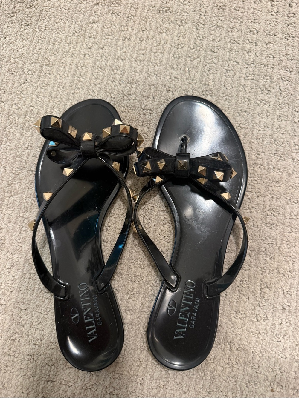 Valentino Garavani Black Jelly Bow Sandals with Gold Rockstuds